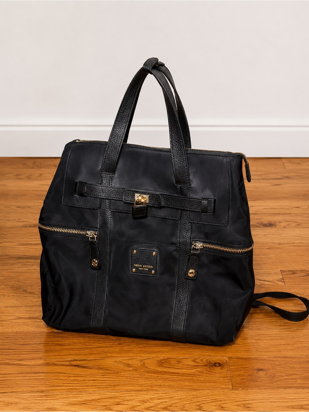 Henri Bendel Black Duffel Bag with Gold Accents